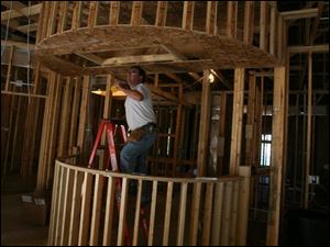 biz build23p  9/19 2007   The Blade/Herral Long  Jack Yoder of Mc Clure oh  electriction with  transtar elect    stand alone business   business/ real estate  section  various shots of workers  and building  Todd Schroyer builder  419 882 3315   lease info  419 882 7002   future home of Dr Matthew Malley DDS  and   Robert Malley DDS   419 882 0622