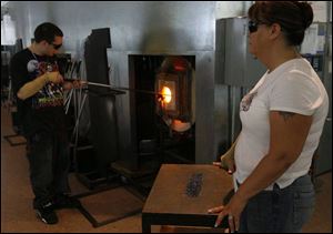 David Valerio with his mother, Deborah Cox, were ordered to take glass-blowing classes, an art therapy course offered through Lucas County Juvenile Treatment Court. Michael and David have been drug-free for months.