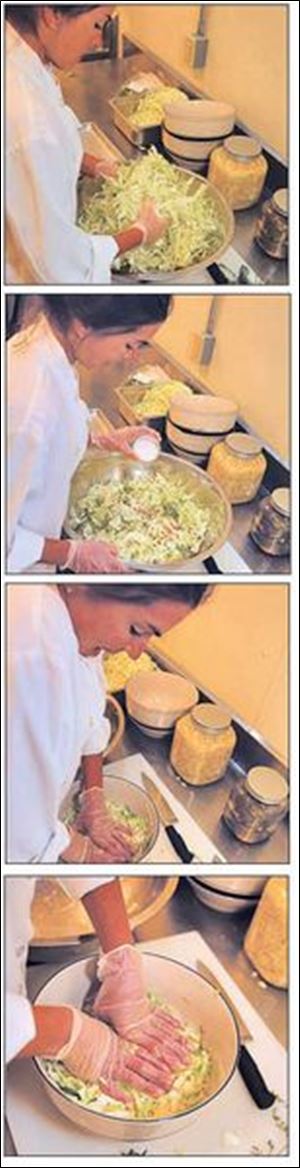 <B>1. </B> Kristen Palmer tosses freshly grated cabbage.
<BR>
<B>2.</B> She then adds salt and the spices to the cabbage.
<BR>
<B>3.</B> Applying firm pressure to the mix releases the water.
<BR>
<B>4.</B> Once pressed, the sauerkraut is ready for fermentation.