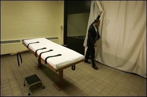 A state employee shows the death chamber at the Southern Ohio Correctional Facility in Lucasville in 2005. The report said Ohio is 3.8 times more likely to impose the death sentence on the killer of a white victim than on a killer of a black person.