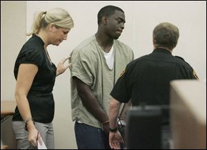 Ohio State quarterback Antonio Henton appears in Franklin County Municipal Court with his attorney, Tasha Ruth.
<br>
<img src=http://www.toledoblade.com/graphics/icons/audio.gif> <font color=red><b>AUDIO:</b></font> <a href=