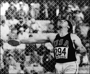 Al Oerter releases the discus at Olympic Stadium in Mexico City during the 1968 Games. His throw  won him his fourth gold medal.