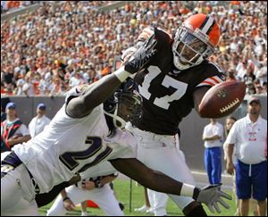 Ravens cornerback Chris McAlister, left, breaks up a pass in the end zone intended for Browns receiver Braylon Edwards.