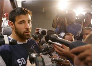 Reporters grill New England player Mike Vrabel about his hit on Sunday against Cleveland Browns tackle Joe Thomas.