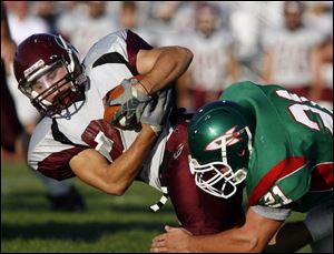 Blair Skilliter, a junior, gains yardage against Oak Harbor. SKilliter has been instrumental as a punk/kick returner. He had an 83-yard kick return for a touchdown against Eastwood.