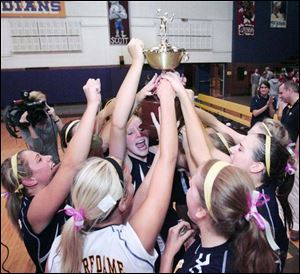 Notre Dame players celebrate their victory over Central Catholic in the City League volleyball championship at Waite.
