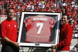 Steelers quarterback Ben Roethlisberger, left, is presented his Miami jersey by the university president David Hodge prior to yesterday's game with BGSU. Ben graduated from Findlay High.