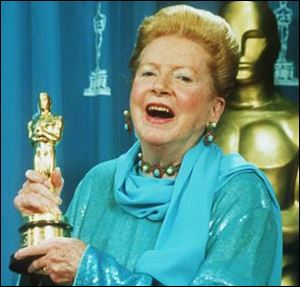 Deborah Kerr holds her Oscar, which was presented to her as an honorary award at the Academy Awards in Los Angeles, March 21, 1994. 