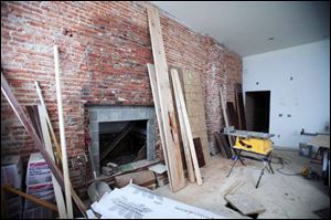  A fire place and exposed brick wall will highlight the lobby area of the historic City Hotel in downtown Monroe.