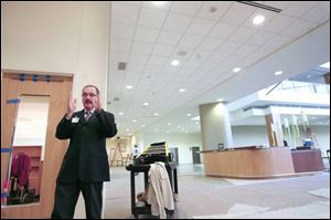 Gary Gordon, president of Toledo Hospital, stands in the lobby of the new building, construction of which began in 2005. 