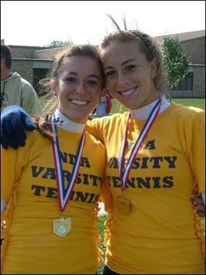 Notre Dame's Tara Majdalani, left, and Meredith Morse wear district champions medals. They were third at state in 2005 and and lost in the quarterfinals last season.