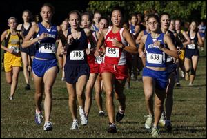 Central's Emma Kertesz (695) came away with a victory in one of the Division I district cross country meets yesterday. 