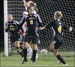 Northview s Brooke Taylor (6), Paige Maroney (4) and Taylor Delaney celebrate a goal.
