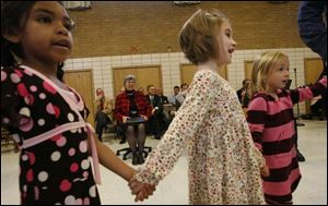 As first lady Frances Strickland watches, Kenwood Elementary School students including, from left, Natasha Thompson, Madison Kramp, and Haley Small perform a folk dance. 