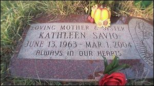 A photo taken from video shows the grave site of Kathleen Savio at the Queen of Heaven Catholic Cemetery in Hillside, Ill., on Thursday, Nov. 8, 2007. Savio was the third wife of Bolingbrook (Ill.) Police Officer Drew Peterson whose bloody and bruised body was found in her bathtub in 2004.