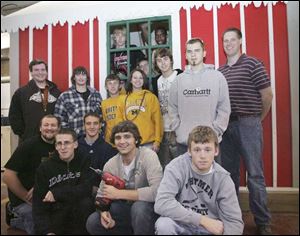 NBRW house23p  Whitmer Construction Academy seniors with the house they built for Santa Claus, under the direction of teacher Phil Kraus (cq), standing at right,  in Toledo, Ohio on November 15, 2007. The house will be disassembled and moved to Levis Commons in Perrysburg, Ohio on November. Designed by The Collaborative, the house collapses for storage. The Blade/Jetta Fraser