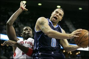 Deron Williams drives to the hoop against Detroit's Antonio McDyess. Williams had 21 points.