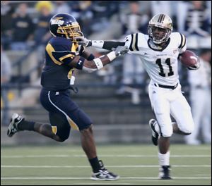 Toledo safety Barry Church, left, shown making a tackle against Western Michigan, is looking for some help on defense next year and is 
especially anxious to team up with 
experienced 
players. The 
Rockets were near the bottom of the 
Mid-American 
Conference in 
several defensive statistical 
categories while compiling a 5-7 record.