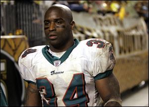 Ricky Williams played in his first game for the Dolphins in nearly two years Monday. He gained 15 yards on six carries.