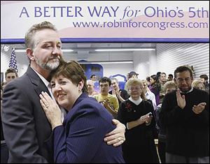 Brush Weirauch hugs his wife, Robin, at her campaign headquarters in Bowling Green after she conceded to Bob Latta Tuesday night.