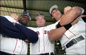 Roger Clemens, center, mugs for the camera with Red Sox 
ex-teammates Mo Vaughn, left, and Jose Canseco in 1995.