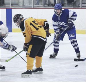 Erin Miller, right, has been playing hockey against boys since she was 9 years old. She is a forward for the Blue Devils. 