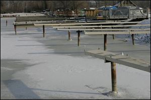 A study of western Lake Erie warns that Lake Erie could drop
6.5 feet in the next 50 years. The lack of water and ice is shown at
the Anchor Point Marina near Bono
in Ottawa County.
