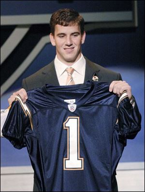 Eli Manning wasn't too excited after being drafted first by the Chargers in 2004. However, Philip Rivers was all smiles after being traded to the Chargers in 2004.
