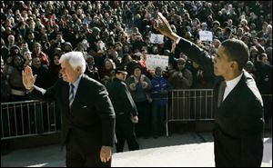 Democratic presidential hopeful, Sen. Barack Obama, D-Ill., right, and Sen. Ted Kennedy, D-Mass., visit an outside overflow crowd on the campus of American University in Washington on Monday. 