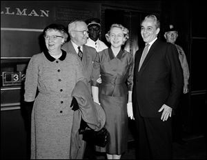 Former President Harry S. Truman and his wife, Bess, are greeted by their daughter, Margaret, and her husband, Clifton Daniel, on arrival in New York in this Sept. 8, 1957, file photo. 