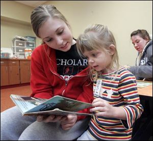 NBRN kids31p  2 01/23/2008   BLADE PHOTO/Lori King    Bedford High School sophomore Sydney Lenhart reads to Keira Dillingham, 3, during MOPS (Mothers of Preschoolers) program at Crossroads Community Church in Ottawa Lake, Mich.