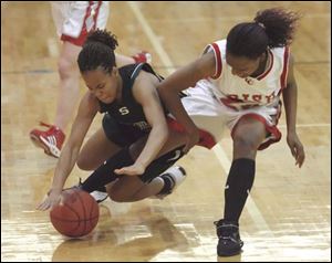 Start's Shaleca McCorey, left, and Central Catholic's Danielle Lewis get tangled up in pursuit of the basketball.