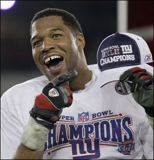 New York Giants defensive end Michael Strahan celebrates after the Giants beat the New England Patriots.