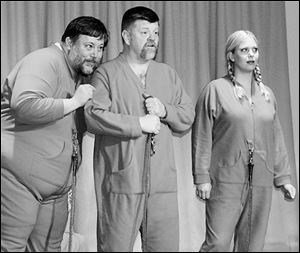 From left, Jeff Smith, Kevin Harrington, and Tara Adams portray three fetuses sharing a womb in Deliver Us Not!