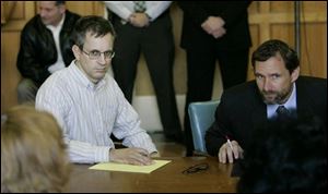 Riems is pictured on left in court.