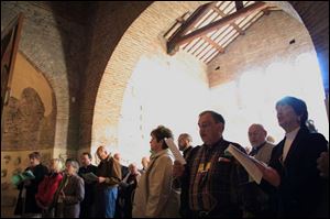 Lutheran and Catholic pilgrims share common prayer at the Saint Callistus Catacombs in Rome. 