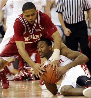 Indiana's Eric Gordon, top, battles for a loose ball with Ohio State's David Lighty. Gordon scored 15 points.