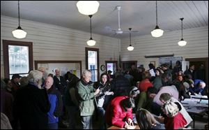 Maine Democrats crowd the town hall for their caucus in Arrowsic. Turnout was heavy Sunday despite snow and bitter winds. 
