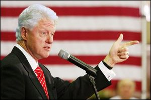 Former President Bill Clinton urges a Toledo audience to support his wife, Hillary Rodham Clinton, in her bid to become the Democratic nominee and the first female U.S. president.
