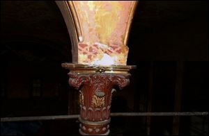 An ornate column graces the opera hall. Estimates for restoration and for razing and building new are both $2.5 million.

