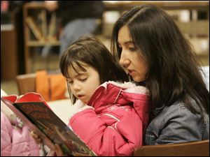 NBRS wedding21p  Diane Ausmus, right, reads "Library Mouse" to her daughter Alexandria Ausmus, 4. They are from Summerfield, Michigan. Around 200 people attend an open house to celebrate the completion of renovations and expansion of the Summerfield-Petersburg Branch of the Monroe County Library System in Petersburg, Michigan library in February 17, 2008. The library was too small, with book return carts used as extra shelving space. Now, says Doris Sheldon, branch librarian, the library will be able to "double its collection" and still have room fro growth. [They will email the square footage increase tomorrow, Monday.] The Blade/Jetta Fraser