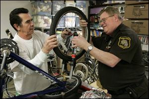 Arnoldo Bedoyestrada, a trusty in the Monroe County Inmate Dormitory, works with Corrections Officer Kenneth Cain. 