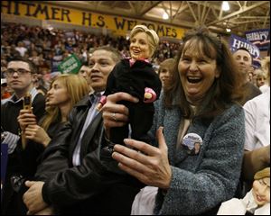 Pam Bloomfield of Bowling Green and her doll seemed to like what they heard from Hillary Clinton at last night s rally. She was among more than 3,000 in the crowd at Whitmer High School.