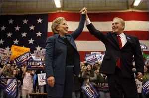 Hillary Clinton is joined by Gov. Ted Strickland at the Whitmer High School rally. Some consider
the Ohio governor a possible running mate if Mrs. Clinton gets the Democratic nomination.