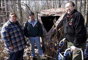 From left, State Rep. Peter Ujvagi, Gil Kollarik and Bob Harsanje at a hunting blind near Luckey. The two convinced Ujvagi to sponsor a bill helping the mobility impaired gain hunting sites.