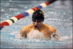 St. John's senior Jake Epperson heads toward a title in the 100-yard breaststroke yesterday in the state swimming championships. On Friday, Epperson won the 200 individual medley.