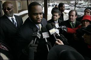 Mayor Kwame Kilpatrick talks to reporters at the Greenhouse Senior Apartments in Detroit. Yesterday council called for his resignation.