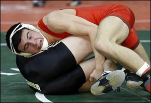 Kirk Tank of Oak Harbor scores the winning takedown against Hunter Pool of Bellefontaine Benjamin Logan during a Division II 152-pound semifinal. 
<img src=http://www.toledoblade.com/graphics/icons/photo.gif> <b><font color=red>VIEW</b></font color=red>: <a href=