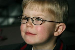Gavin Losey, 3, in Adidas sports frames with bifocal lenses.