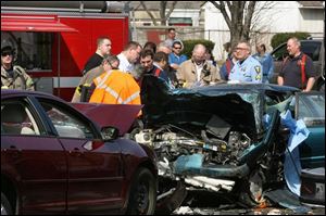 A collision on Sylvania and Matlack avenues yesterday left two dead in one car and injured two occupants of a second car.